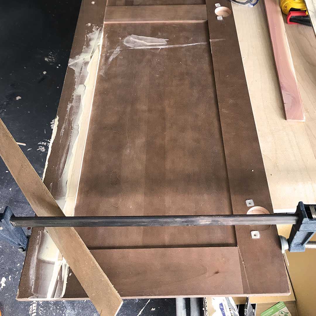 Faded chair in the process of being sanded during restoration